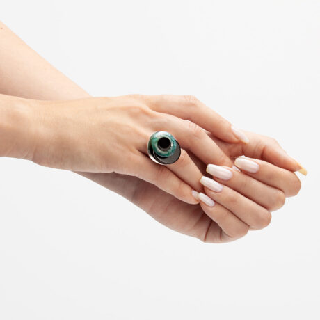 Baj handmade sterling silver, onyx and moss agate ring on hands designed by Belen Bajo