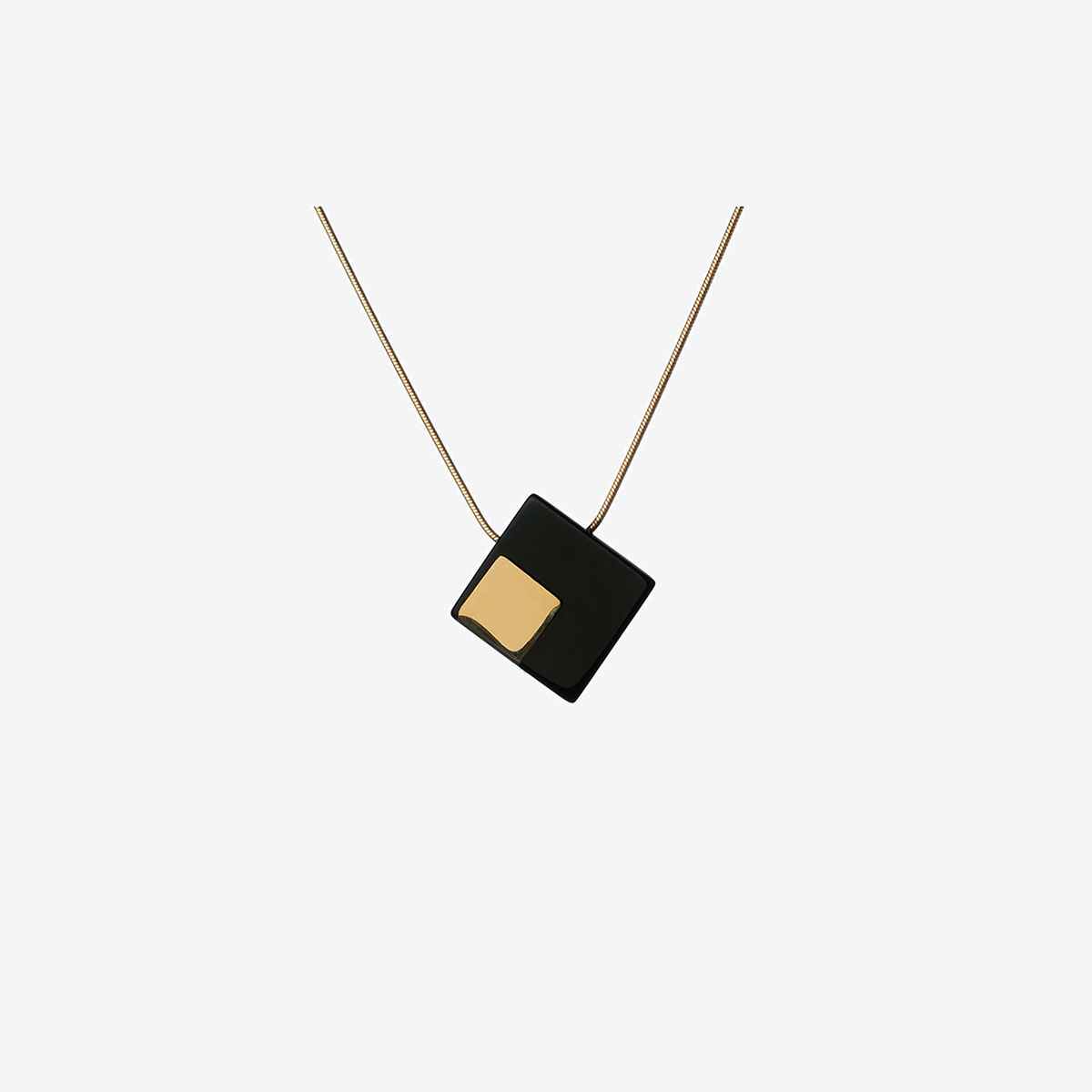 Handmade Emi necklace in 9k or 18k gold, sterling silver and onyx designed by Belen Bajo