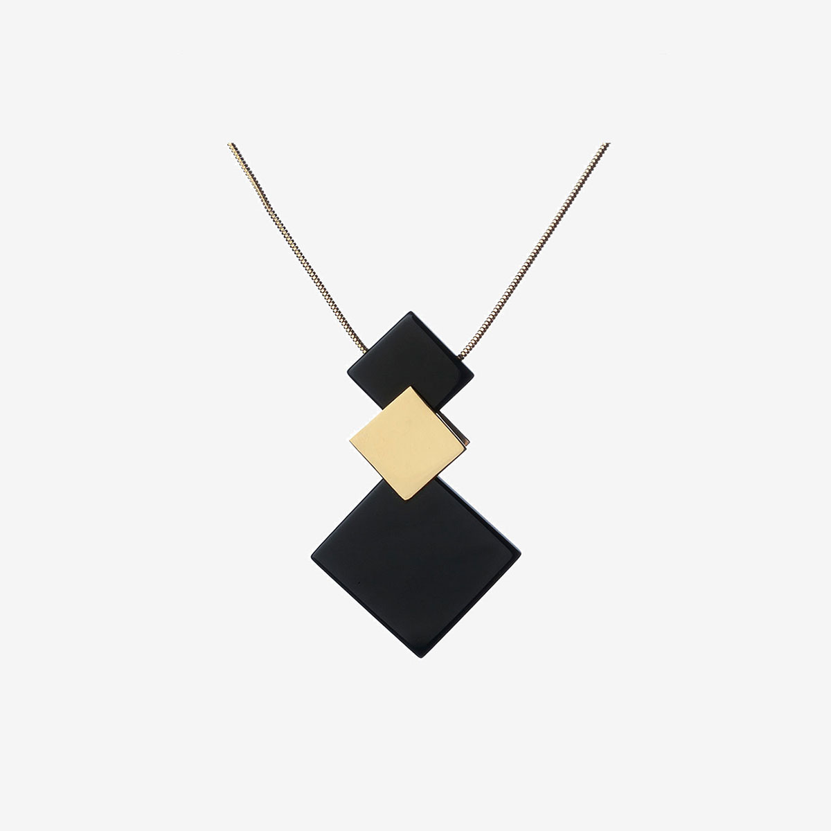 Handmade Toy necklace in gold, sterling silver and onyx designed by Belen Bajo