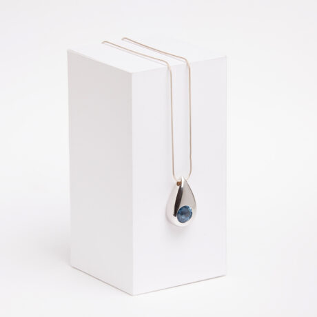 Handmade Tao necklace in sterling silver and blue zirconia designed by Belen Bajo