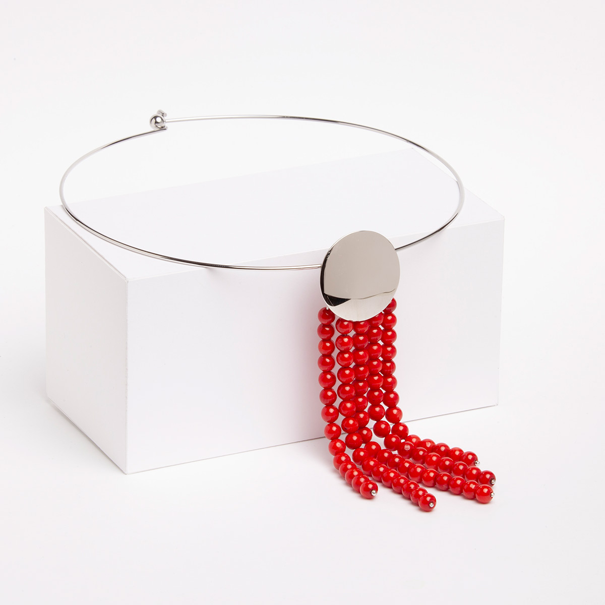 Handmade sterling silver and coral Tik necklace designed by Belen Bajo