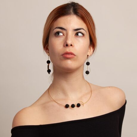 Sia handmade earrings in 9k or 18k gold and black lava in a model designed by Belen Bajo