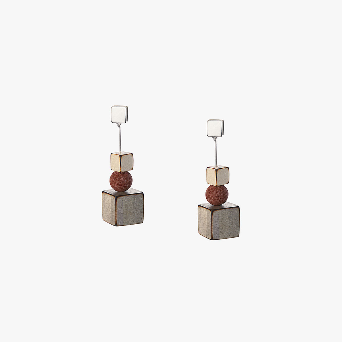 Dal handmade earrings in sterling silver, balsa wood and volcanic lava in sepia color designed by Belen Bajo