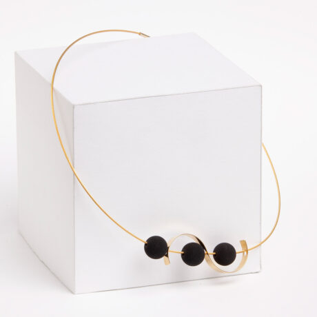 Handmade Sia necklace in 9k or 18k gold and black lava designed by Belen Bajo