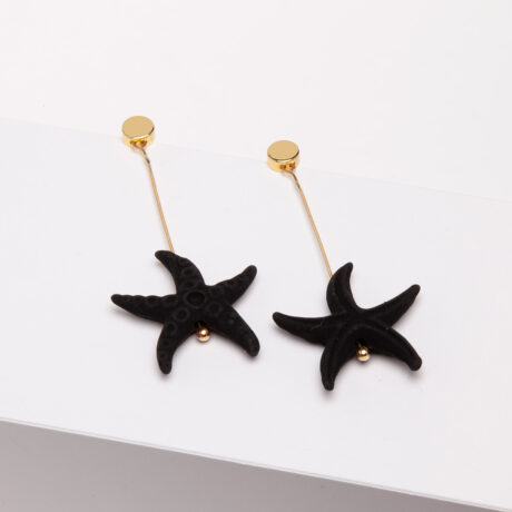 Bel handmade earrings made of 925 silver plated in 18 carat gold, black lava star and 18 carat gold pieces designed by Belen Bajo